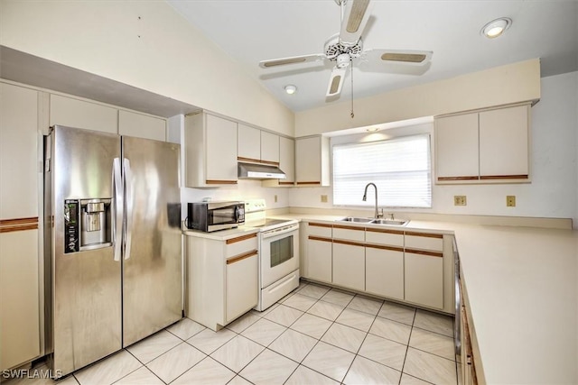 kitchen featuring white cabinetry, ceiling fan, sink, stainless steel appliances, and lofted ceiling