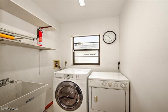 laundry area featuring washer and dryer and sink