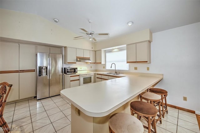 kitchen featuring kitchen peninsula, appliances with stainless steel finishes, ceiling fan, and sink