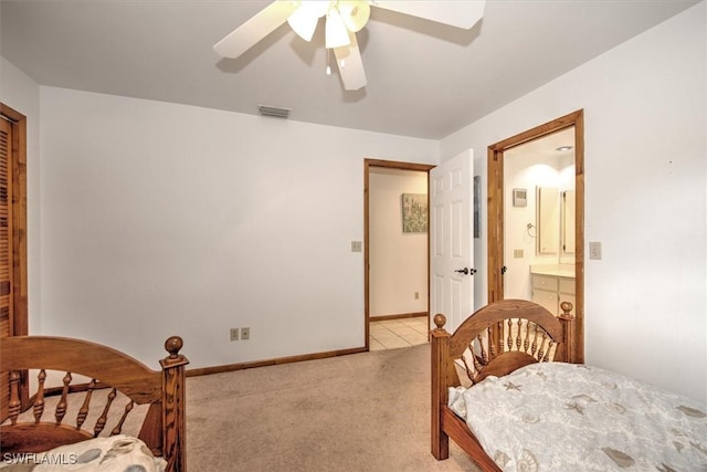 carpeted bedroom featuring ceiling fan and connected bathroom