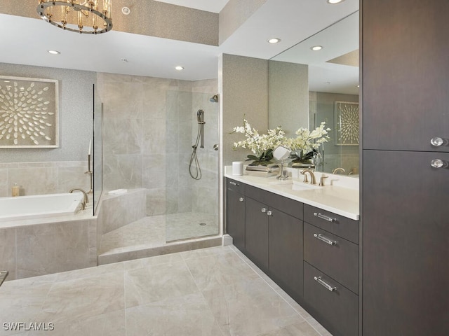 bathroom featuring vanity and separate shower and tub