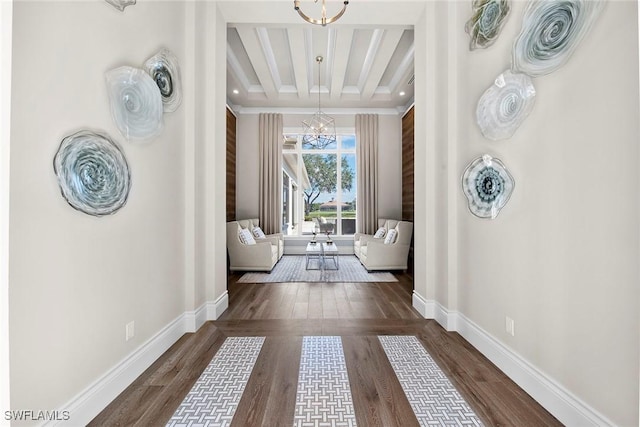 doorway to outside featuring dark wood-style floors, beamed ceiling, baseboards, and an inviting chandelier