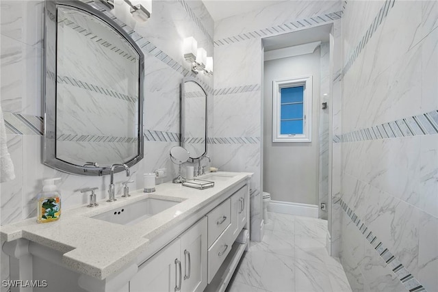 bathroom featuring vanity, a shower, toilet, and tile walls