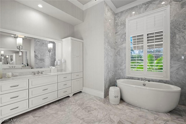 bathroom with a bathing tub and vanity