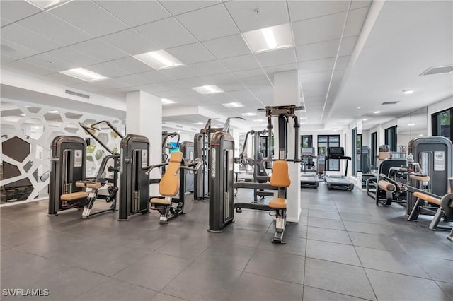 workout area featuring a drop ceiling