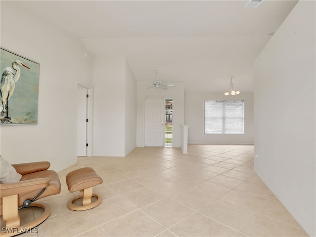 sitting room featuring high vaulted ceiling, ceiling fan with notable chandelier, and light tile patterned floors