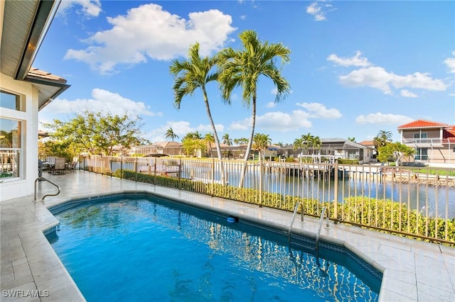 view of pool with a water view