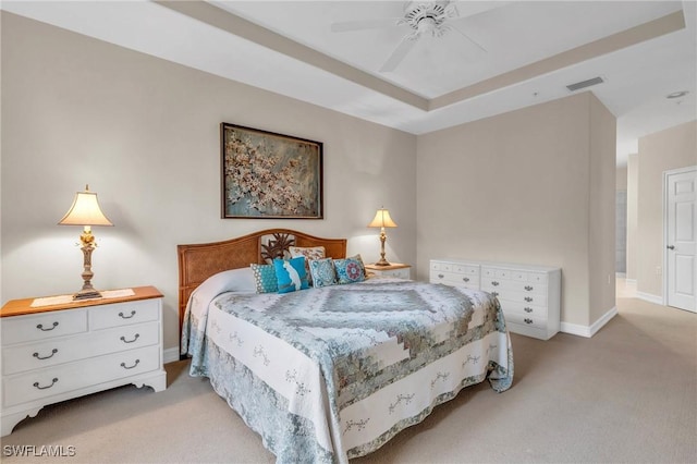 bedroom with ceiling fan and light colored carpet