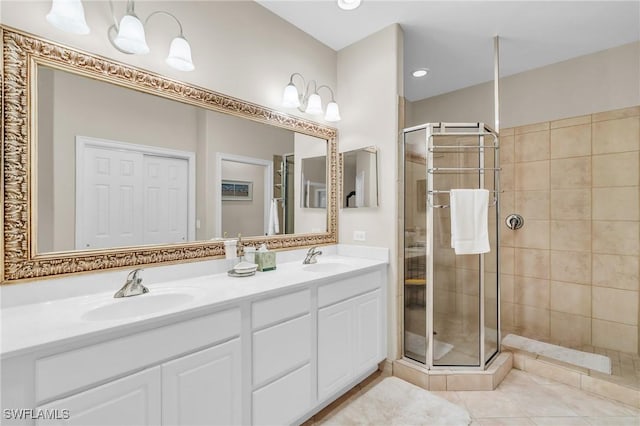 bathroom featuring vanity, tile patterned floors, and walk in shower