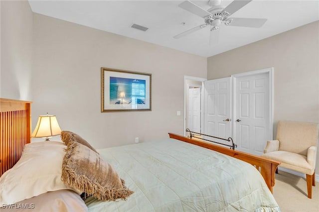 bedroom with ceiling fan and a closet