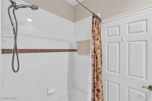 bathroom featuring shower / bath combination with curtain