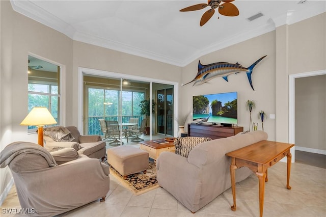 living room featuring light tile patterned floors, ceiling fan, and ornamental molding