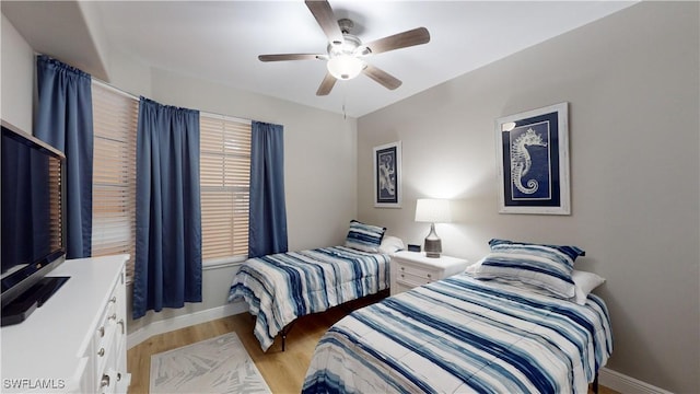 bedroom featuring light hardwood / wood-style flooring and ceiling fan