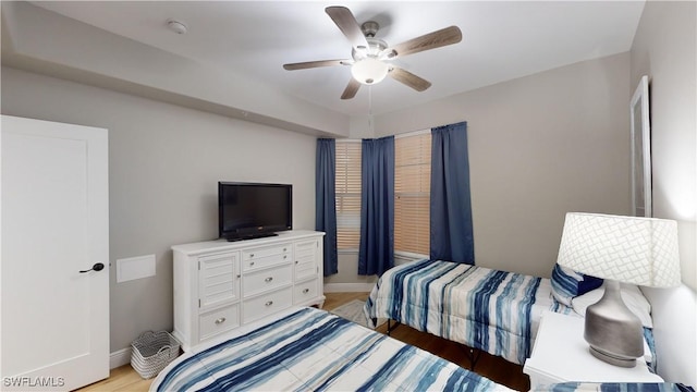 bedroom with ceiling fan and light wood-type flooring