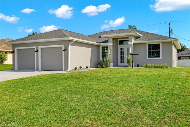 view of front facade with a garage and a front yard