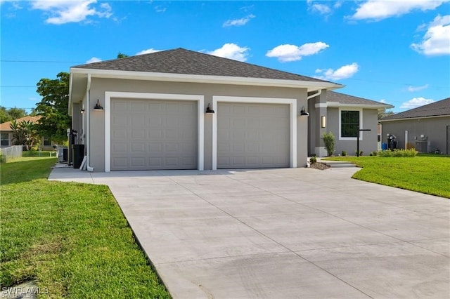 view of front of property featuring central AC, a front lawn, and a garage