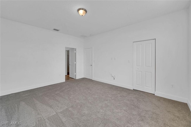 unfurnished room with carpet flooring