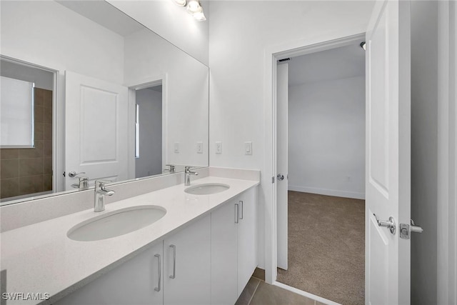 bathroom with tile patterned floors and vanity