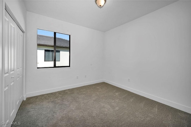 unfurnished room featuring carpet flooring