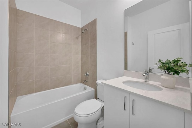 full bathroom with tile patterned floors, vanity, toilet, and tiled shower / bath