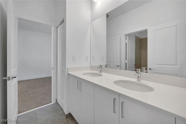 bathroom featuring tile patterned flooring and vanity