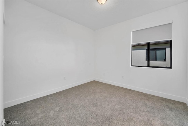 unfurnished room with carpet floors