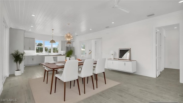 dining space featuring light wood-type flooring