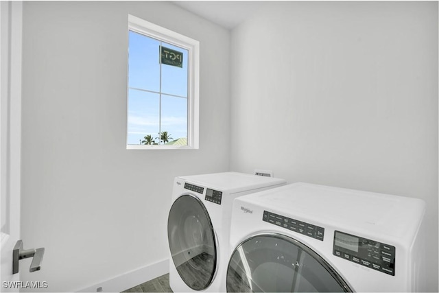 3190 Shell Mound Blvd, Fort Myers Beach, FL 33931 - laundry room featuring laundry area, baseboards, separate washer and dryer, and wood finished floors