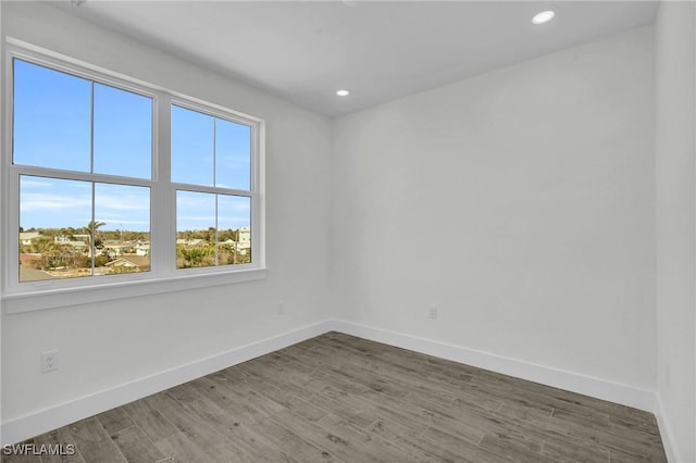 3190 Shell Mound Blvd, Fort Myers Beach, FL 33931 - empty room with baseboards, recessed lighting, and wood finished floors