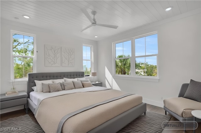 3190 Shell Mound Blvd, Fort Myers Beach, FL 33931 - bedroom with multiple windows, recessed lighting, and dark wood-style flooring