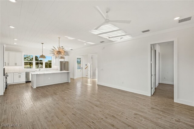 3190 Shell Mound Blvd, Fort Myers Beach, FL 33931 - unfurnished living room with a ceiling fan, recessed lighting, light wood-style flooring, and visible vents