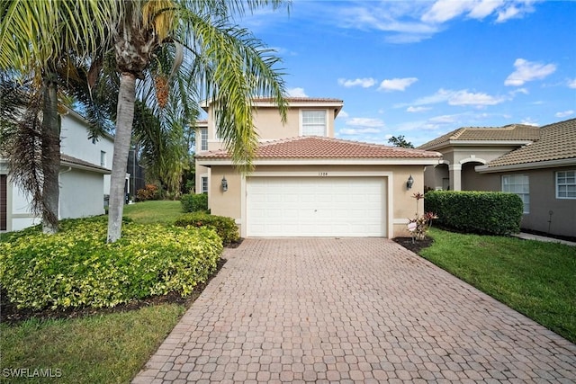 view of front of house with a garage and a front lawn