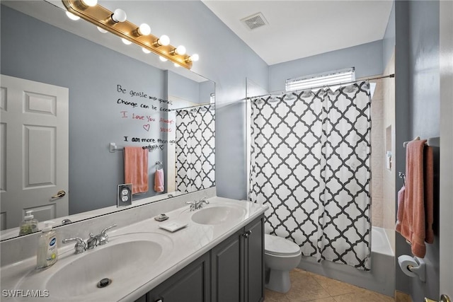 full bathroom with tile patterned floors, vanity, toilet, and shower / bath combo with shower curtain