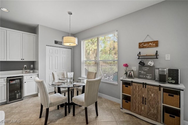 dining room featuring light tile patterned floors and wine cooler