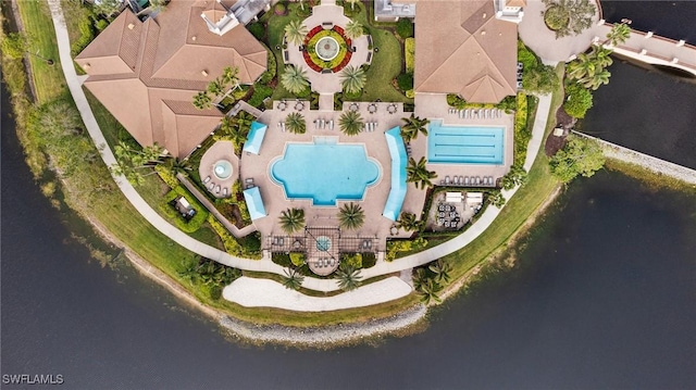 birds eye view of property with a water view