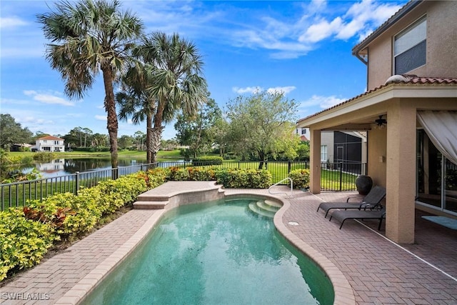 view of swimming pool featuring a water view