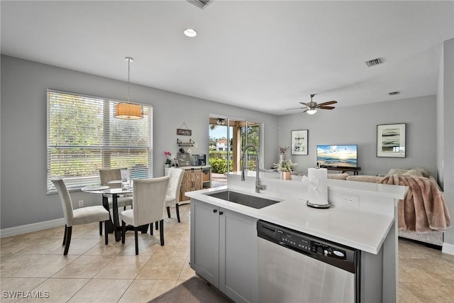 kitchen featuring gray cabinetry, ceiling fan, dishwasher, sink, and hanging light fixtures