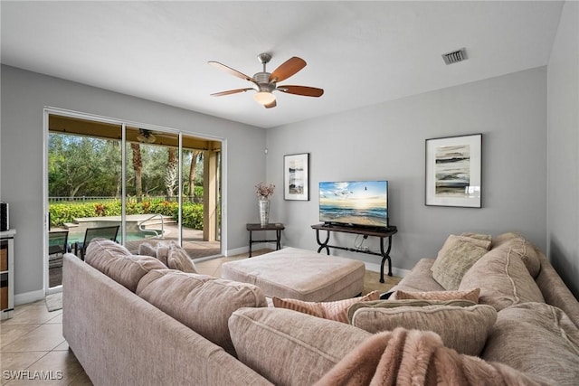 tiled living room featuring ceiling fan