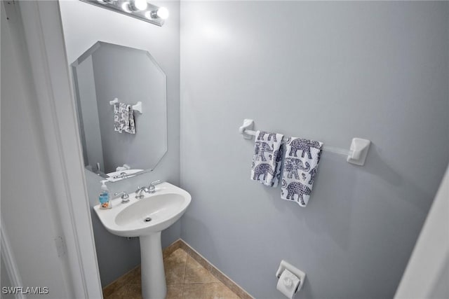 bathroom with tile patterned floors