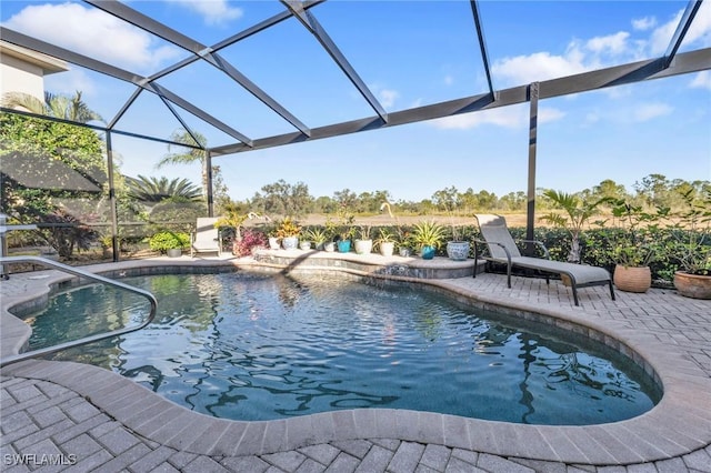 view of pool featuring a lanai and a patio