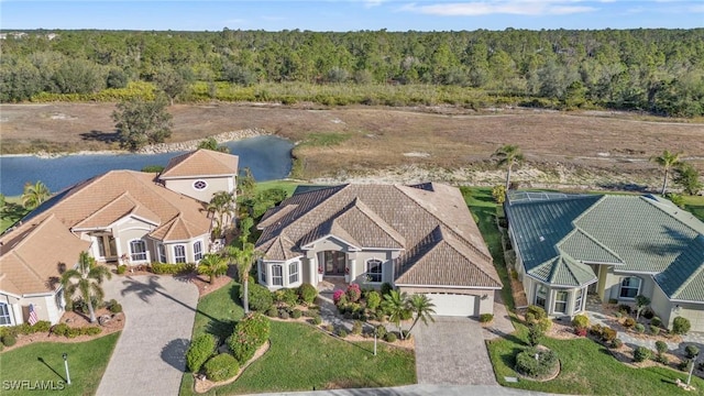 birds eye view of property with a water view