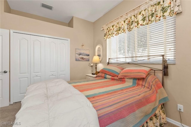 carpeted bedroom with a closet