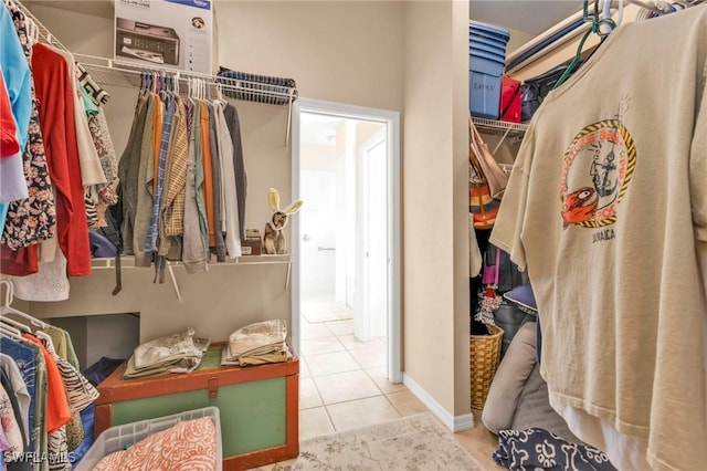 spacious closet with light tile patterned floors