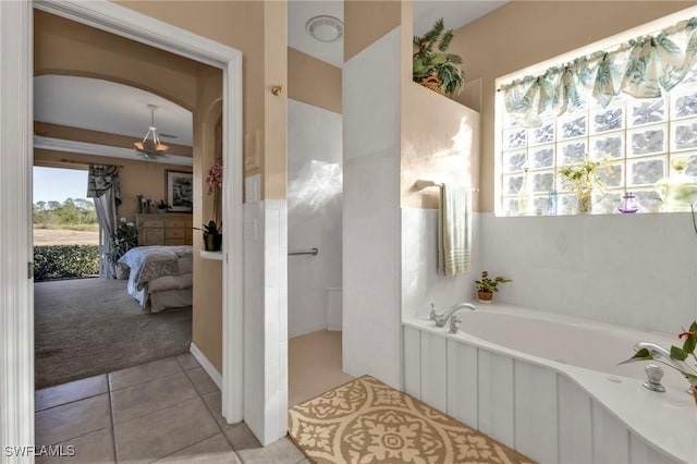 bathroom featuring tile patterned flooring and a bathtub