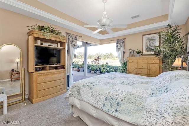 bedroom featuring access to outside, a raised ceiling, ceiling fan, and carpet flooring