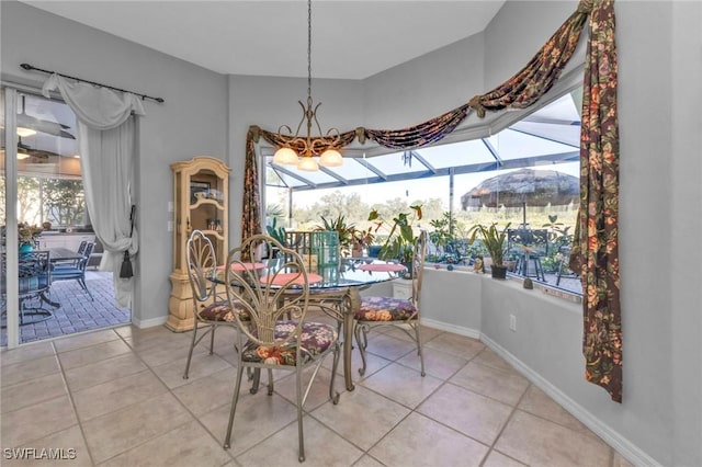 tiled dining space with an inviting chandelier