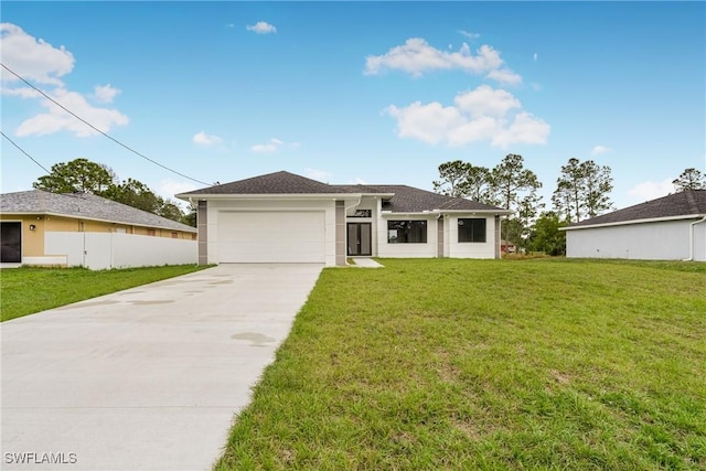 view of front facade featuring a garage and a front yard