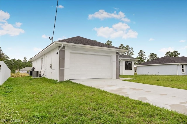 view of front facade featuring central AC, a front lawn, and a garage