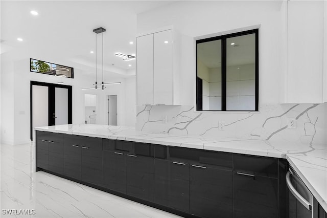 bathroom featuring tasteful backsplash, french doors, and vanity