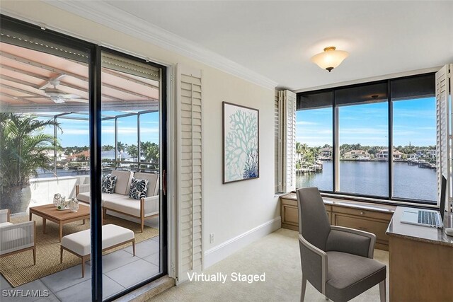 office area featuring crown molding, light carpet, and a water view